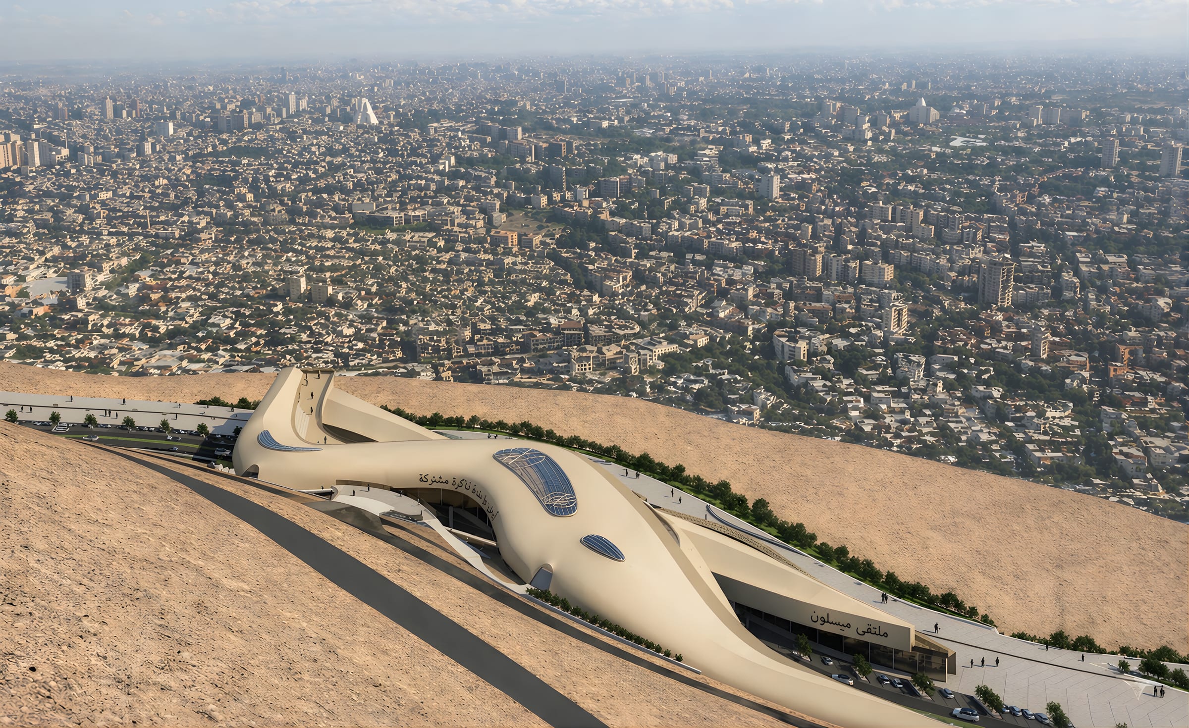 Aerial view of Maysalun Hub, a sinuous sand-coloured building on a hillside above the dense city of Damascus