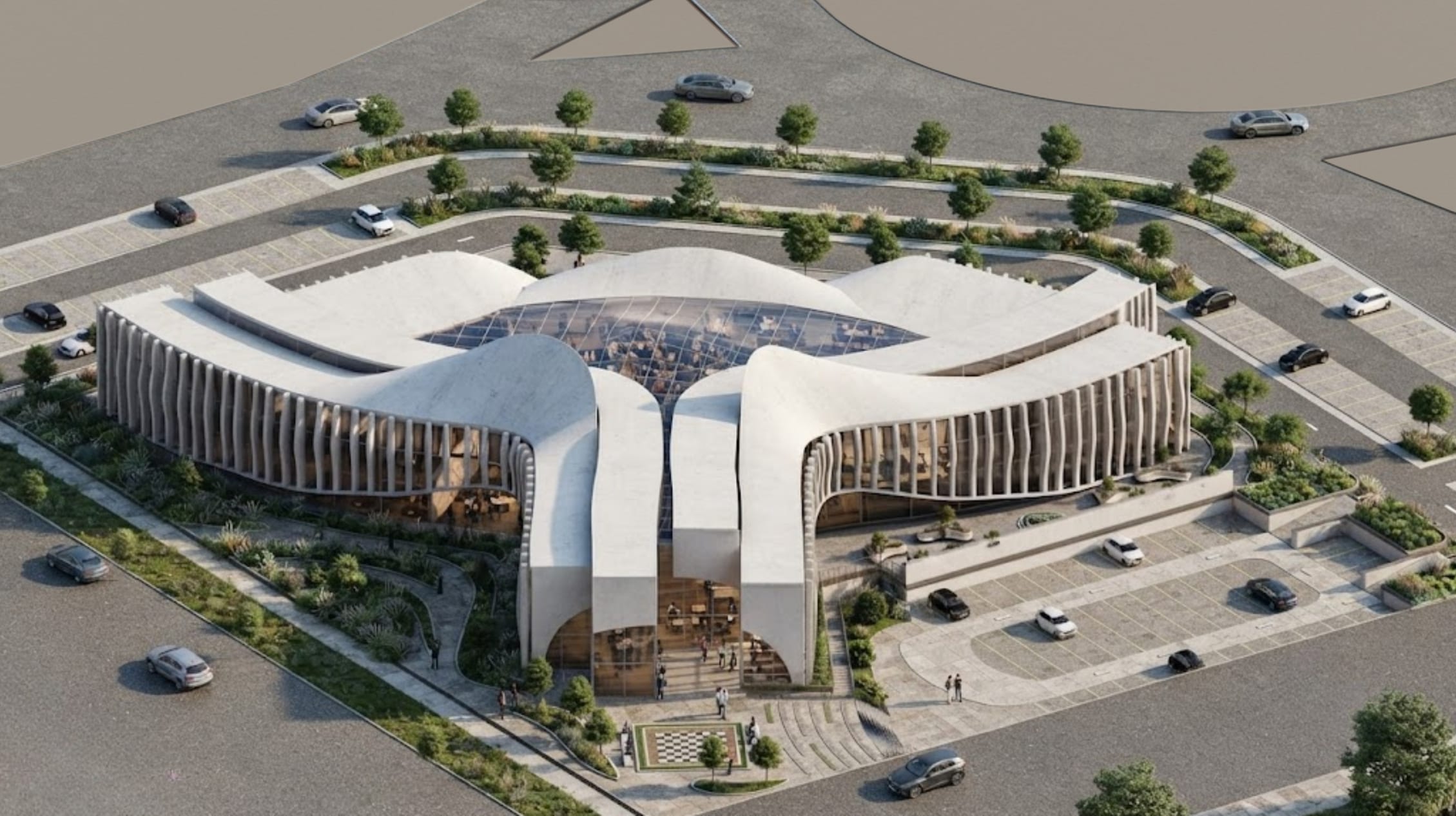 Aerial view of Triforce Library from the roundabout: three curved stone-coloured wings around a glazed skylight
